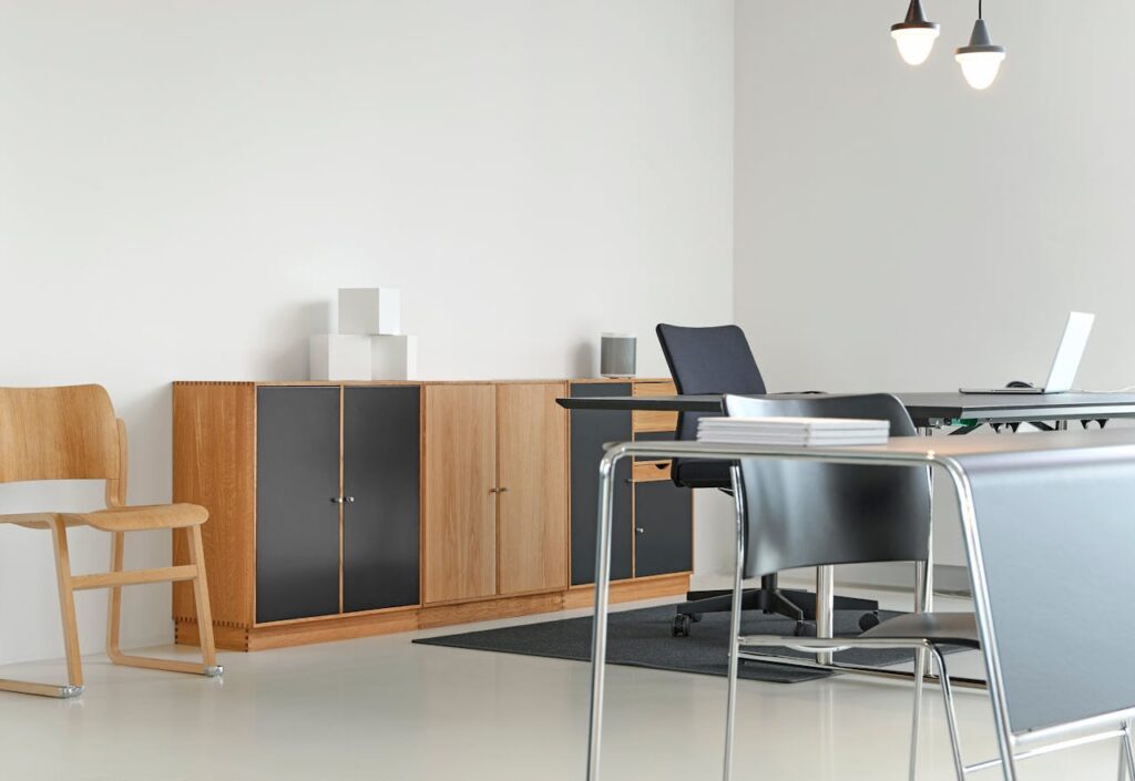 pexels photo 245219 A clean and organized modern office space with stylish furniture and decor.